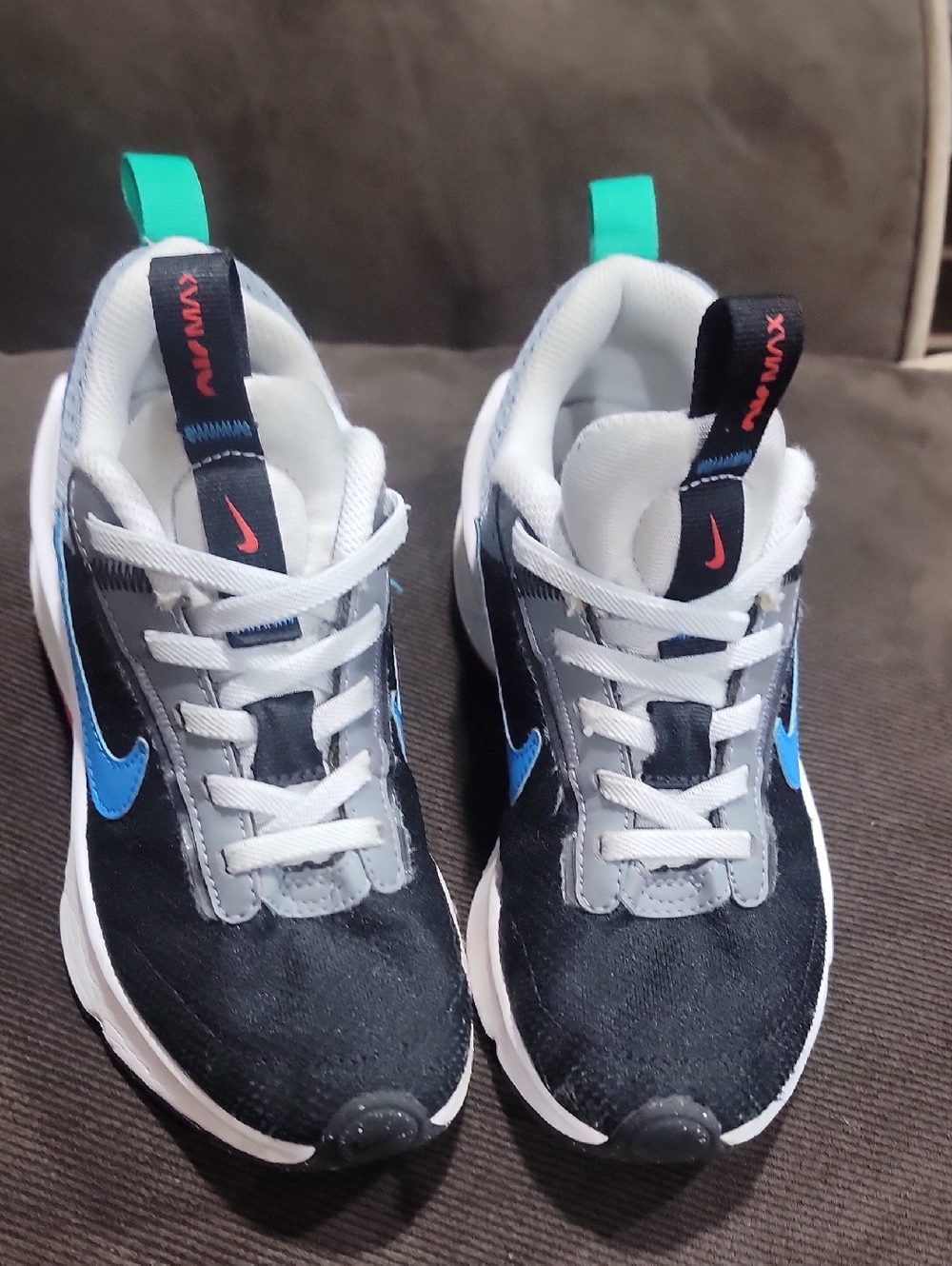 Nike Kids Black Sneakers with Blue Swoosh and Teal Pull Tabs